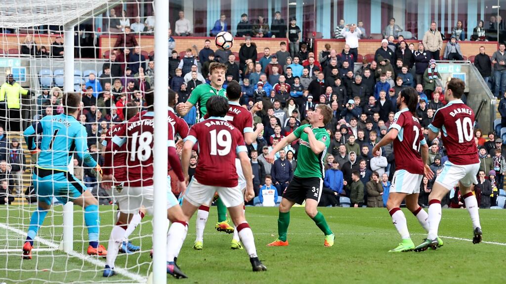 Lincoln City’s Sean Raggett scores his side’s winning goal in the FA Cup fifth-round match against Burnley at Turf Moor. Photograph: Martin Rickett/PA Wire