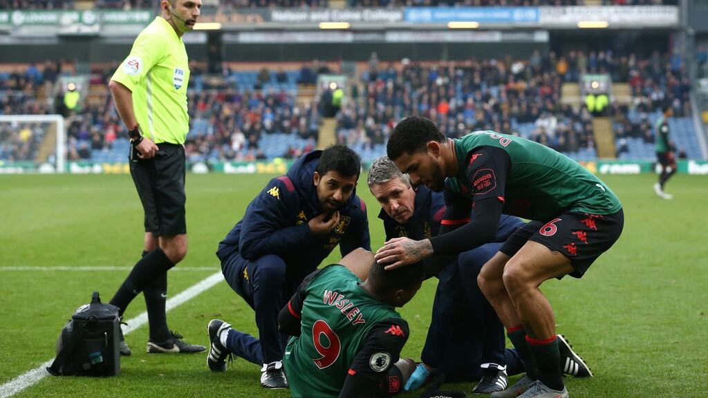 Wesley of Aston Villa receives medical attention during the Premier League match against Burnley. Photo: Jan Kruger/Getty Images