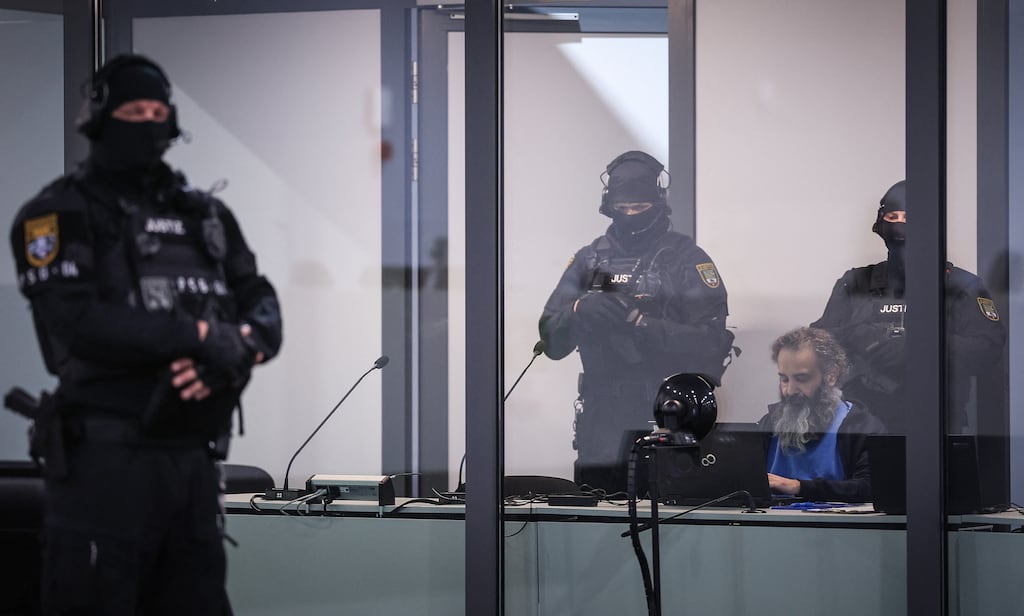 Taleb al-Abdulmohsen sits in a bulletproof glass box in a courtroom in Magdeburg, eastern Germany on Monday. Photograph: Ronny Hartmann/AFP via Getty Images