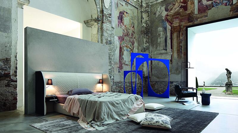 The Cherche Midi bed by Eric Gizard for Roche Bobois has a leather-upholstered bedhead with an invisible base and can be ordered with a one drawer floating bedside table and a reading lamp. Cost: €9,870