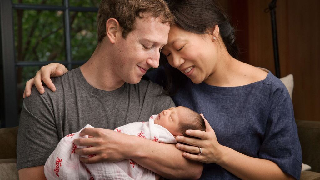 Facebook chief Mark Zuckerberg with his wife Priscilla with their new daughter Max. Zuckerberg announced he had become a father. Photograph: AFP/Getty Images