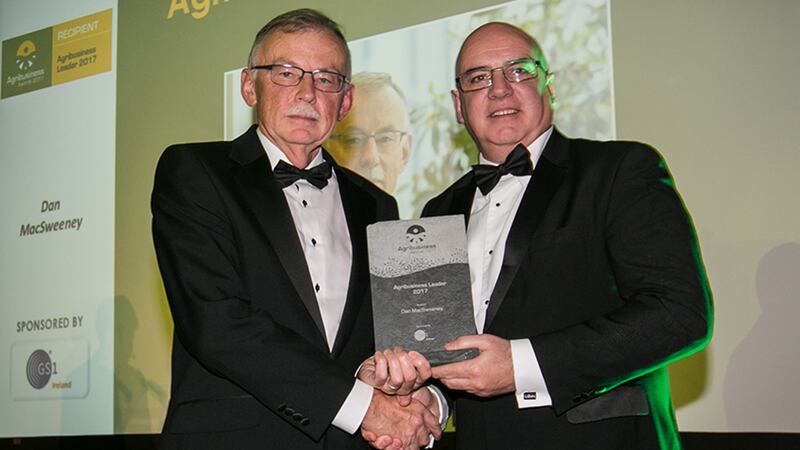 Denis O’Brien, Director of Standards & Solutions, GS1 Ireland, presents the Agribusiness Leader 2017 award to Dan MacSweeney