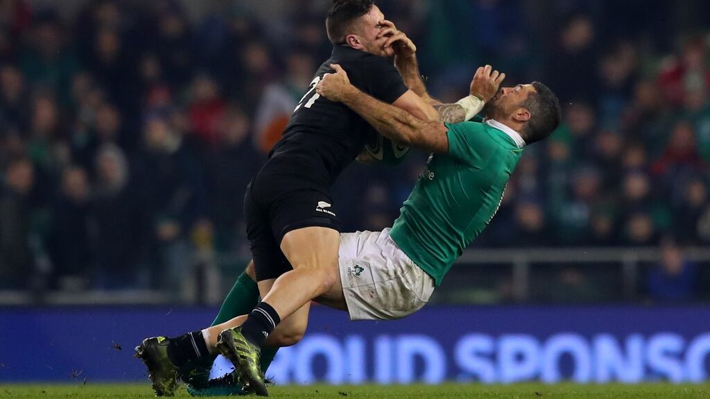 New Zealand’s TJ Perenara and Rob Kearney of Ireland clash at the Aviva Stadium in 2016. Photograph: James Crombie/Inpho