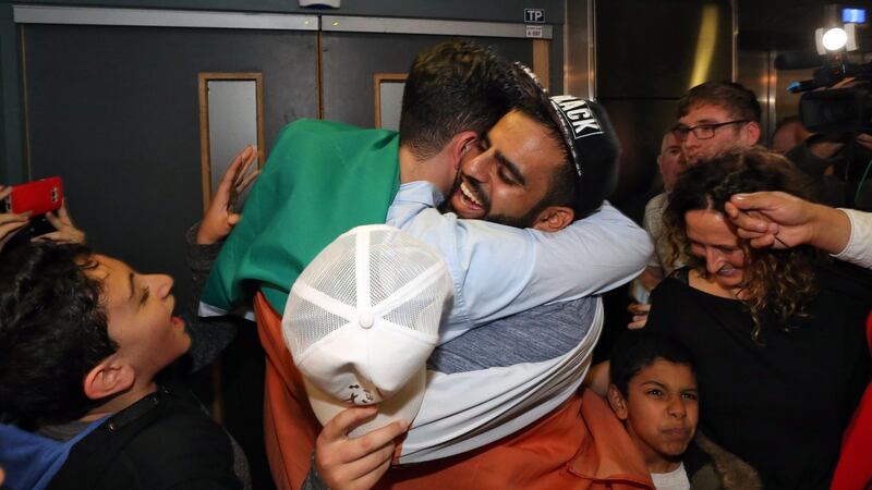 Ibrahim Halawa: the first of many bear hugs. Photograph: Colin Keegan/Collins