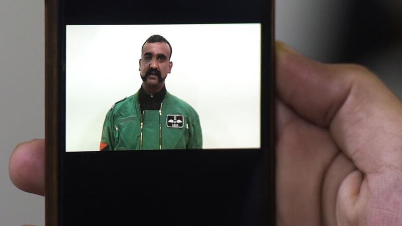 A Pakistani man watches the latest video statement released by Pakistan’s military authorities of the Indian Wing Commander pilot Abhinandan Varthaman (pictured) on his smartphone in Islamabad on March 1st. Photograph: Aamir Qureshi/AFP/Getty