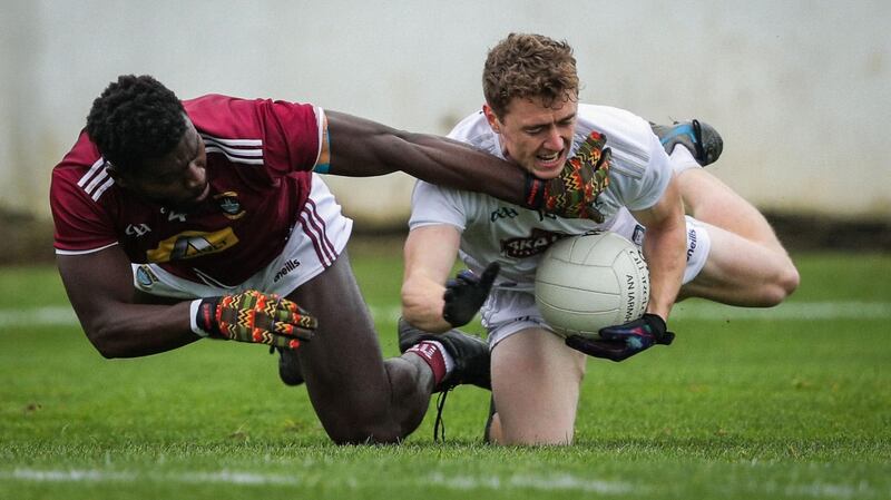 Kildare’s Jimmy Hyland is tackled by Westmeath’s Boidu Sayeh during their Dicision 2 clash. Photograph: Inpho
