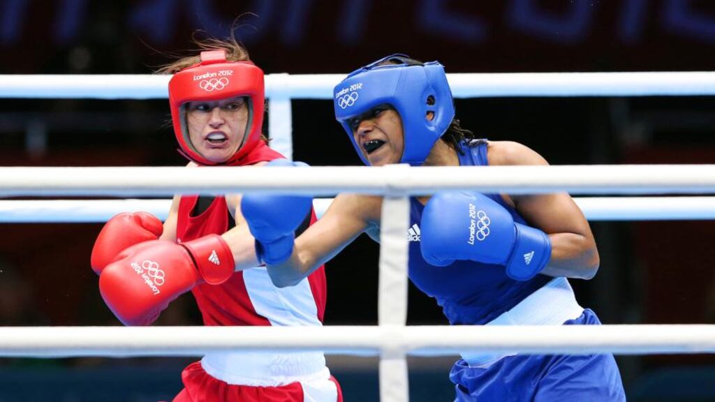 Katie Taylor exchanges blows with Natasha Jonas during their bout at the London Olympics last year. Photograph: Dan Sheridan/Inpho