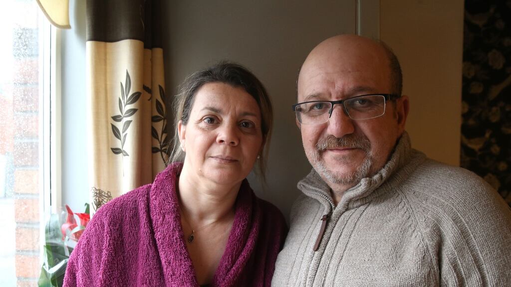 Nora and Athmane Yachir in their north Belfast flat. ‘We weren’t looking for luxury – we just wanted a safe and clean apartment,’ says Athmane. Photograph: Stephen Davison