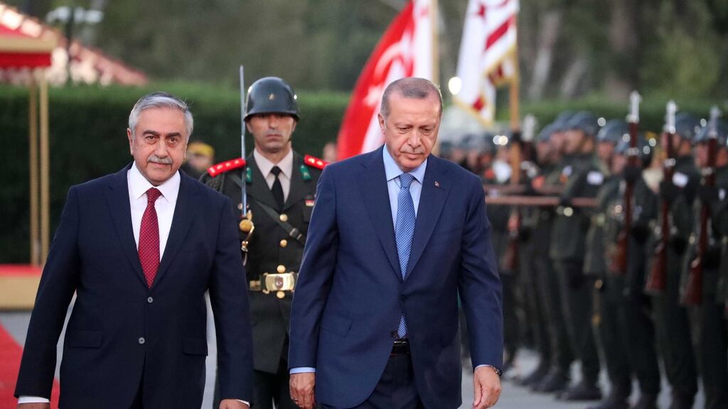 Turkish president Recep Tayyip Erdogan reviewing a military guard of honour with Turkish Cypriot leader Mustafa Akinci in the Turkish Cypriot northern part of the divided city of Nicosia on Tuesday. Photograph: Andreas Manoli/EPA