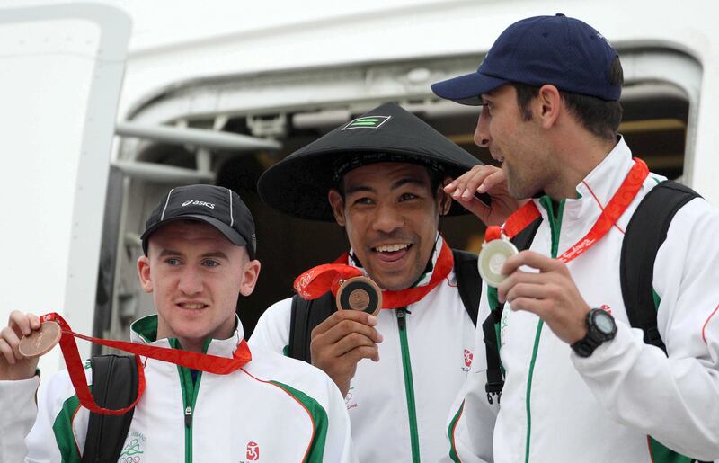 Olympic boxing medal winners Paddy Barnes, Darren Sutherland and Kenny Egan arrive back in Dublin in August 2008. Photograph: Billy Stickland/Inpho