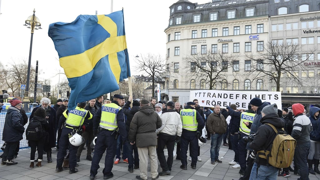 Stockholm police talk to participants of a movement calling itself “The People’s Demonstration” which held a meeting and demonstration in Stockholm, Sweden. Photograph: Marcus Ericsson/TT/AFP/Getty Images