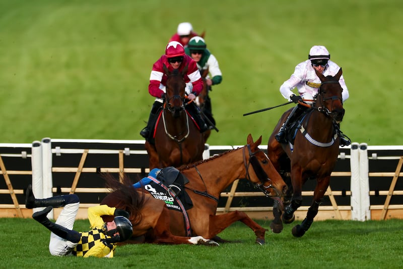 Lorcan Williams riding Golden Ace evades Paul Townend riding State Man as they fall at the last fence during the Champion Hurdle at the 2025 Cheltenham festival. Photograph: Dan Istitene/Getty Images