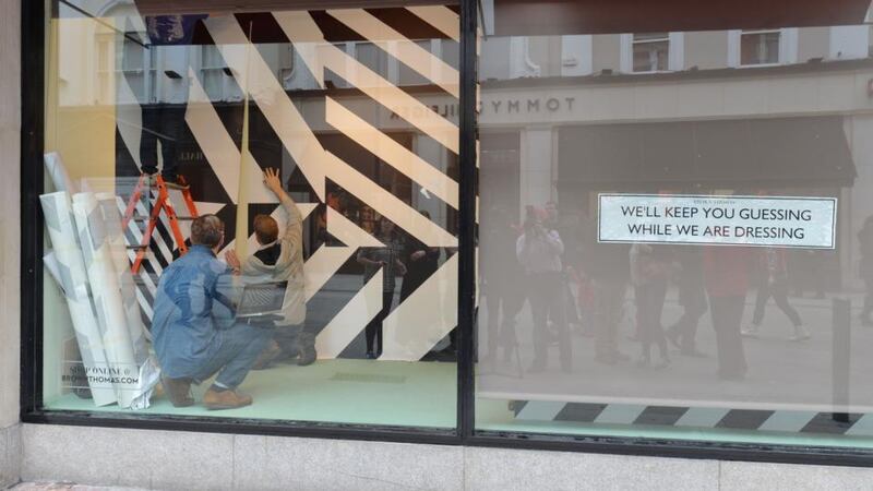 Maser (denim shirt) overseeing his art installation in the windows of Brown Thomas on Dublin’s Grafton Steet. Photograph: Alan Betson