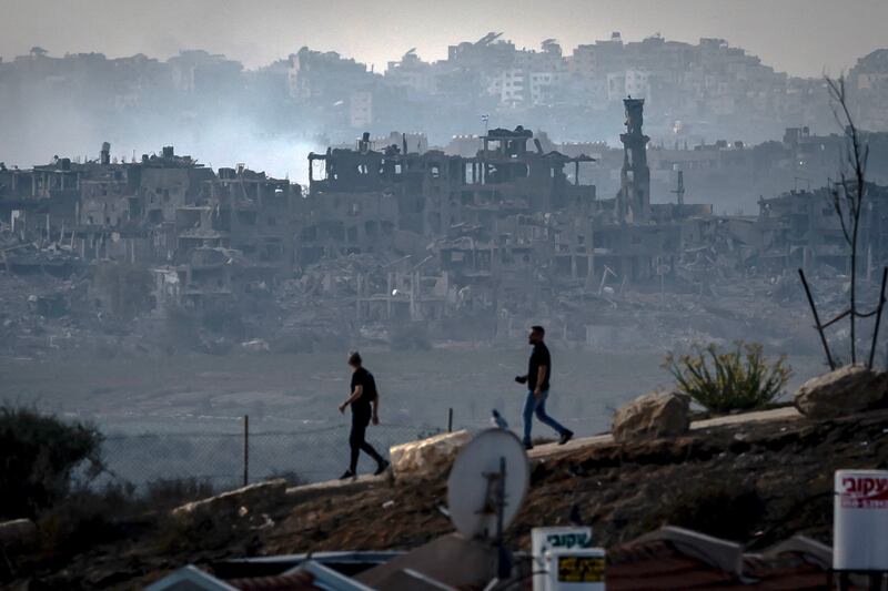 Men walk along the border with the Gaza Strip in southern Israel on Monday. Photograph: Fadel Senna/AFP via Getty