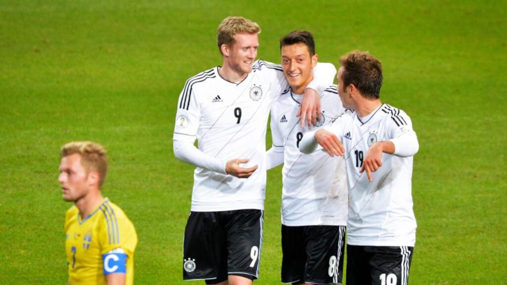 Germany’s Andre Schuerrle (L) celebrates his goal against Sweden with teammates Mesut Ozil (C) and Mario Goetze. Photograph: Jonas Ekstromer/Reuters