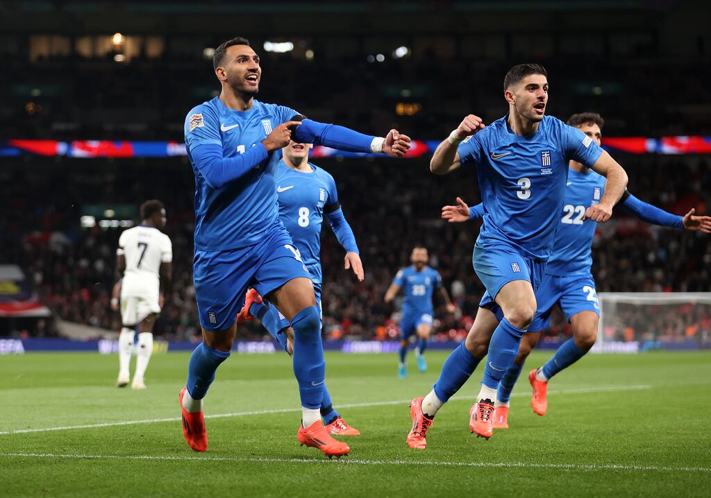 Vangelis Pavlidis of Greece celebrates scoring his team's first goal against England at Wembley Stadium on October 10th, 2024, as he holds his black armband in honour of the passing of former Greek football player George Baldock. Photograph: Julian Finney/Getty Images