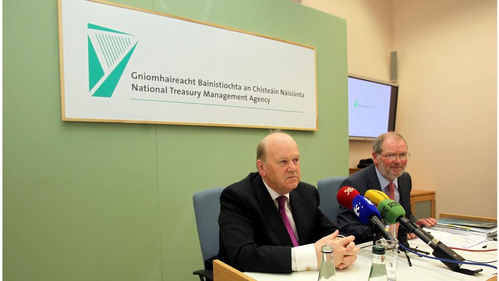Minister for Finance Michael Noonan and NTMA chief executive John Corrigan during the NTMA annual report launch at Treasury Buildings, Dublin. Photograph: Brenda Fitzsimons/Irish Times
