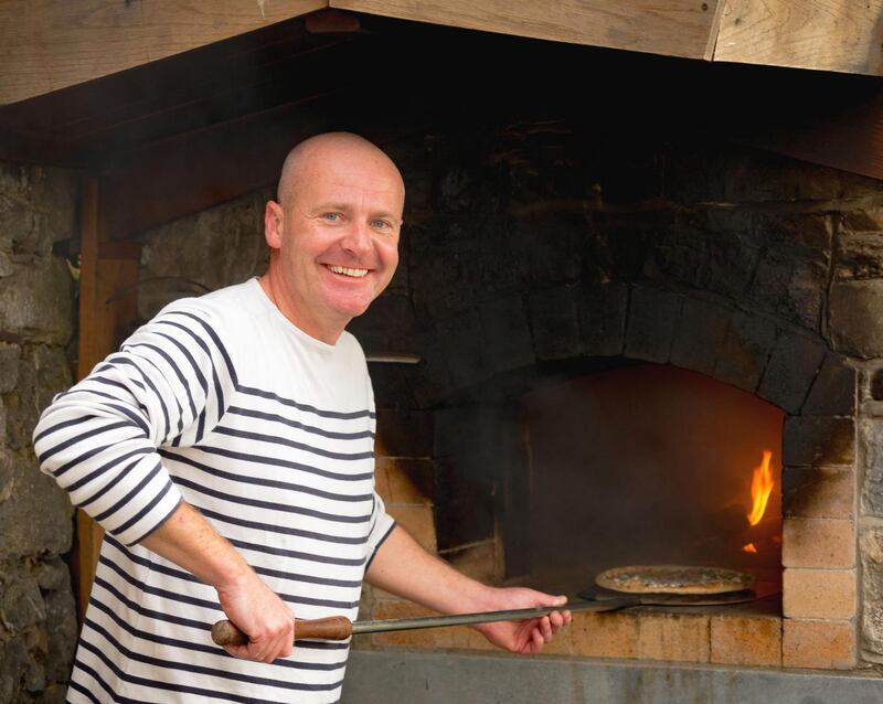 Francis Nesbitt at his outdoor wood-fired oven