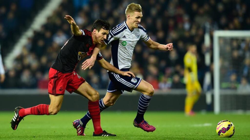 Swansea’s Jack Cork chases Darren Fletcher of West Brom. The win took West Brom to 14th in the Premier League table. Photograph: Stu Forster/Getty Images