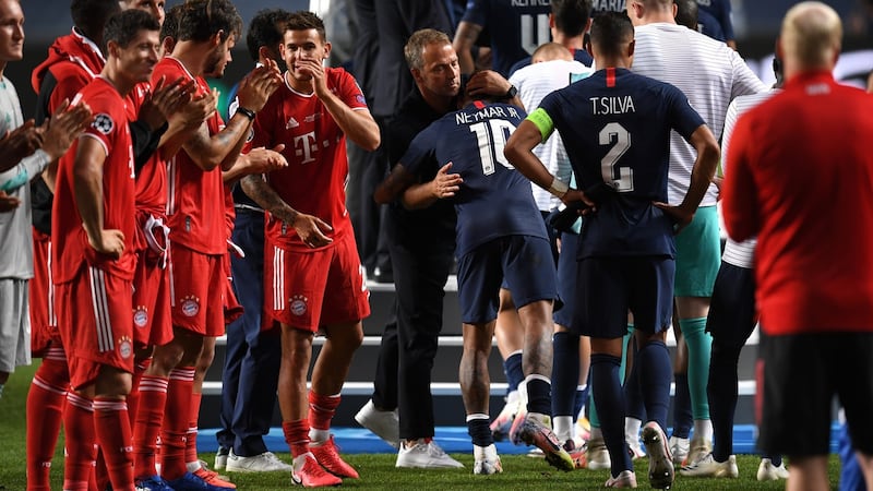 Bayern Munich manager Hans-Dieter Flick embraces Neymar after the match. Photograph: Getty Images