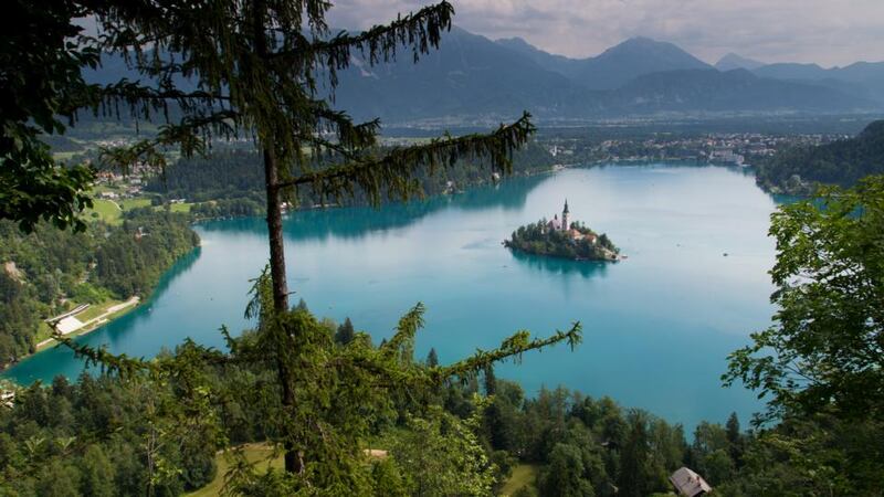 Kayak across Lake Bled in Slovenia before following a trail through the trees to a tea room once used by President Tito.