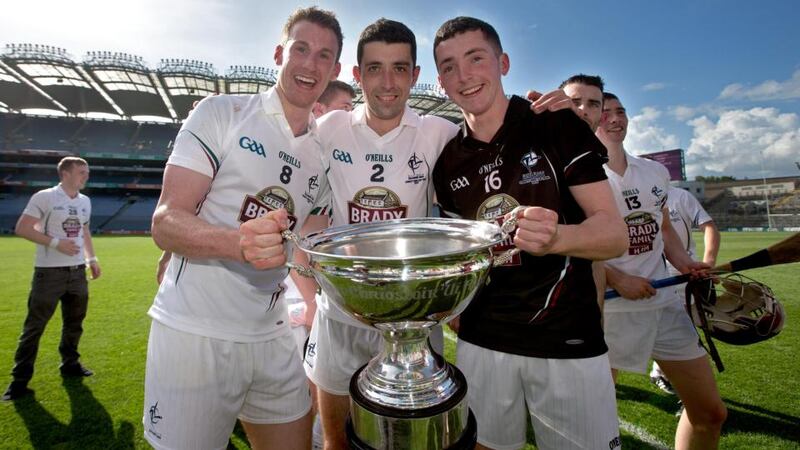 Kildare’s Eanna O’Neill, John Doran and Paddy McKenna celebrate with The Christy Ring Cup. Photograph: Ryan Byrne/Inpho