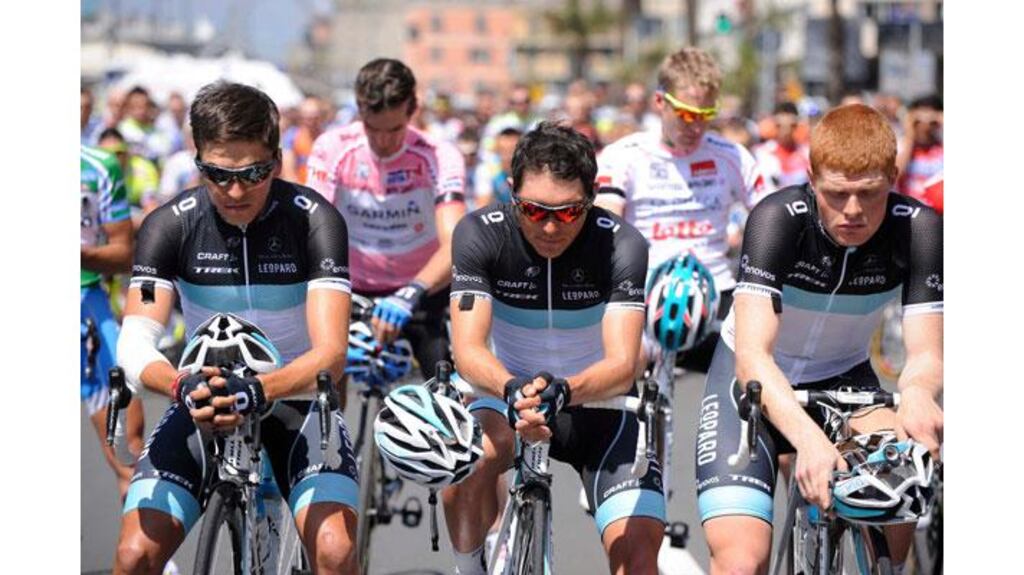 Leopard Trek team riders pay respect to their team mate Wouter Weylandt, who was killed in a crash yesterday, before the start of the fourth stage of Giro d'Italia at Quarto dei Mille. Photograph: Giorgio Perottino/Reuters