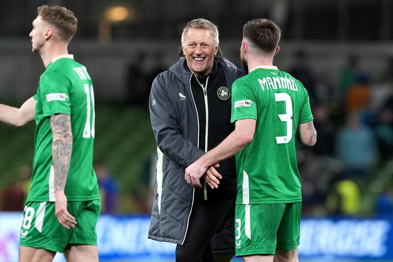 Republic of Ireland head coach Heimir Hallgrimsson (centre) celebrates with player Ryan Manning. Photograph: Brian Lawless/PA Wire