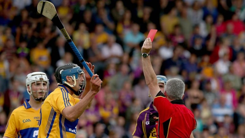 Clare’s Brendan Bugler is shown a straight red card by referee Johnny Ryan during the All-Ireland SHC Qualifier Round 1 Replay at Wexford Park. Photograph: Donall Farmer/Inpho