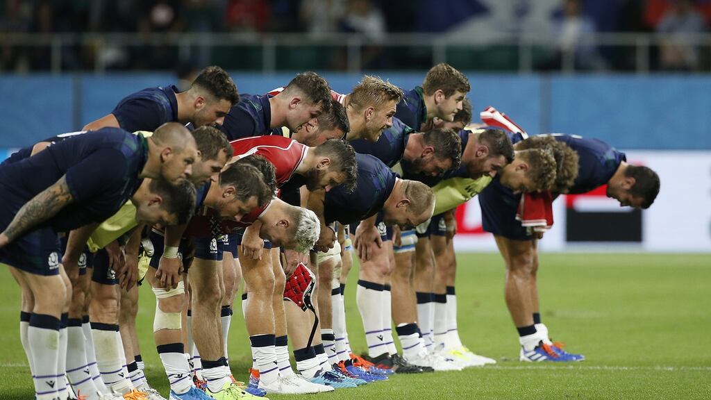Scotland players bow to thank the crowd after their Rugby World Cup win over Russia in Shizuoka. Photo: Mark R. Cristino/EPA