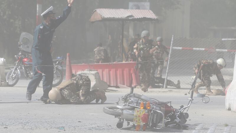 Afghan security forces are seen at the site of a second blast in Kabul, Afghanistan.  Photograph: Omar Sobhani/Reuters