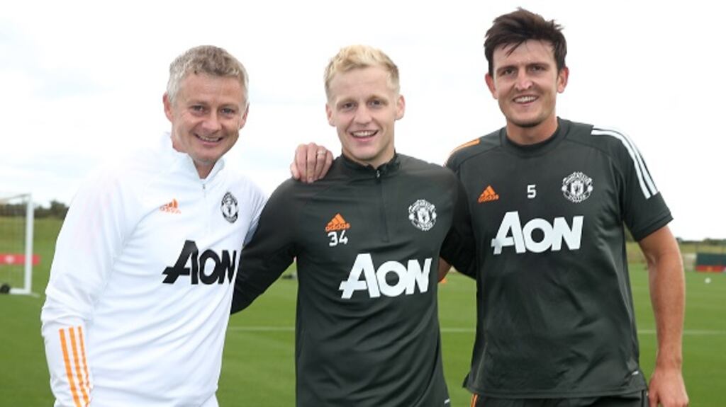 New Manchester United signing Donny van de Beek with  team manager Ole Gunnar Solskjaer and captain Harry Maguire after a recent training session. Photograph: Getty Images