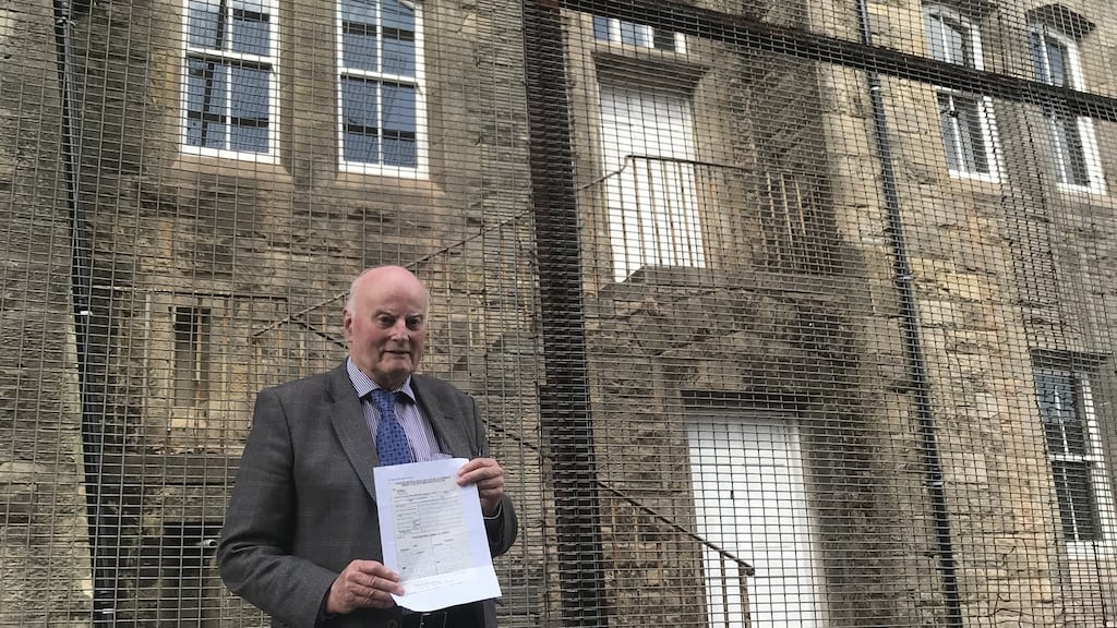Michael McLoughlin, in front of the former police station in Dungannon, Co Tyrone, where he went to hand in the notice applying for the march.