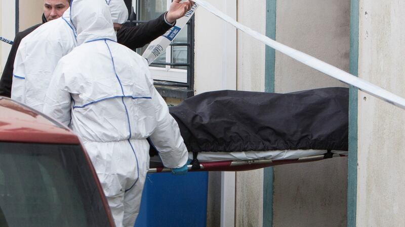 The body of Martin Clancy is removed from his home at Little O’Curry Street in Limerick on Monday. Photograph Liam Burke Press 22