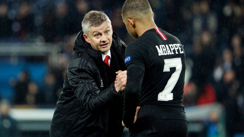 Manchester United caretaker manager Ole Gunnar Solskjaer shakes hands with Paris Saint-Germain’s French forward Kylian Mbappe at the end of Wednesday night’s match. Photograph: Getty Images
