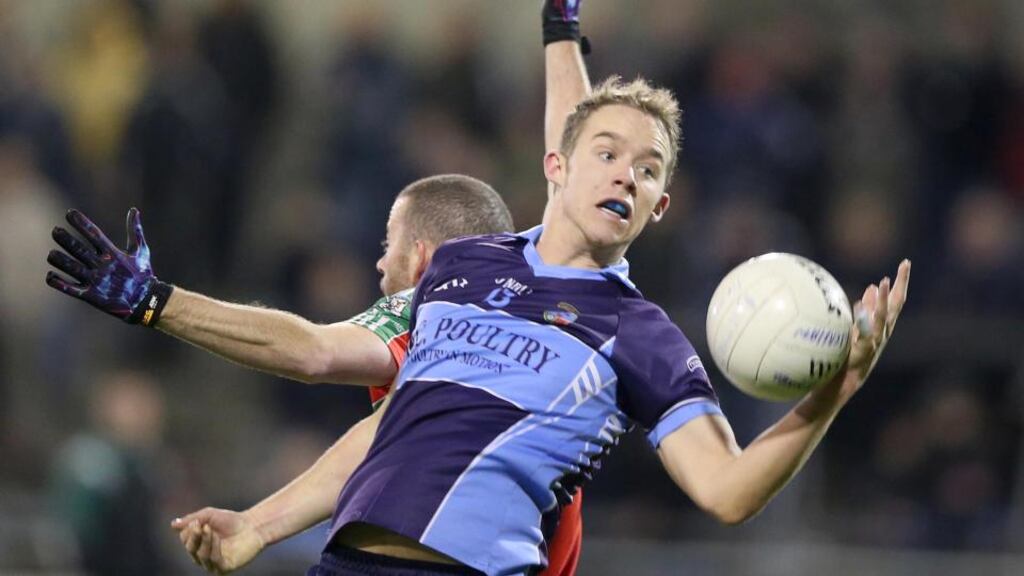 Ballymun Kickhams’ Eoin Dolan with Declan Donnelly of St Jude’s during the Dublin SFC semi-final. Photograph: Inpho