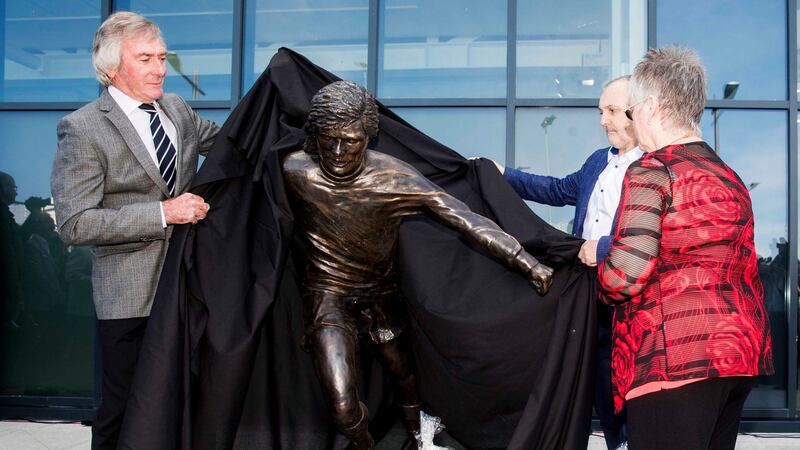 Pat Jennings and  George Best’s sister Barbara McNarry  unveil a statue to George Best outside Winsdor Park in Belfast. Photograph: Liam McBurney/PA Wire