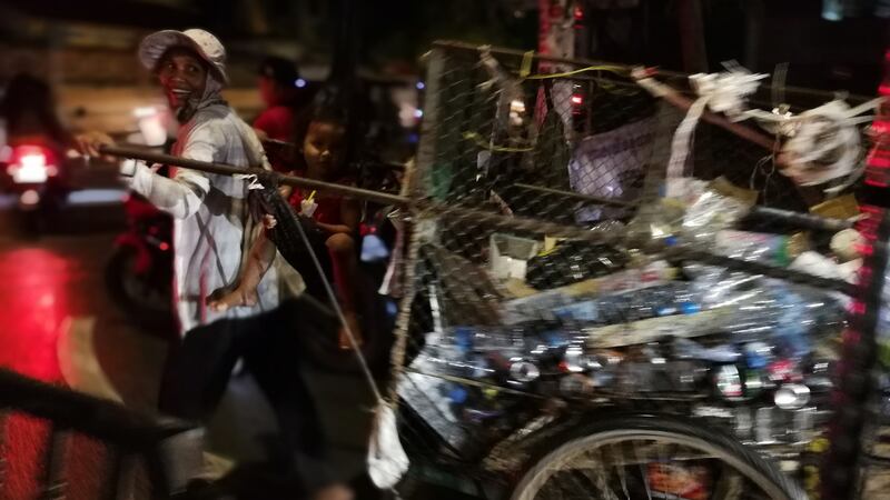 A man pulls a cart filled with waste in Phnom Penh. Photograph: Nevenka Lukin