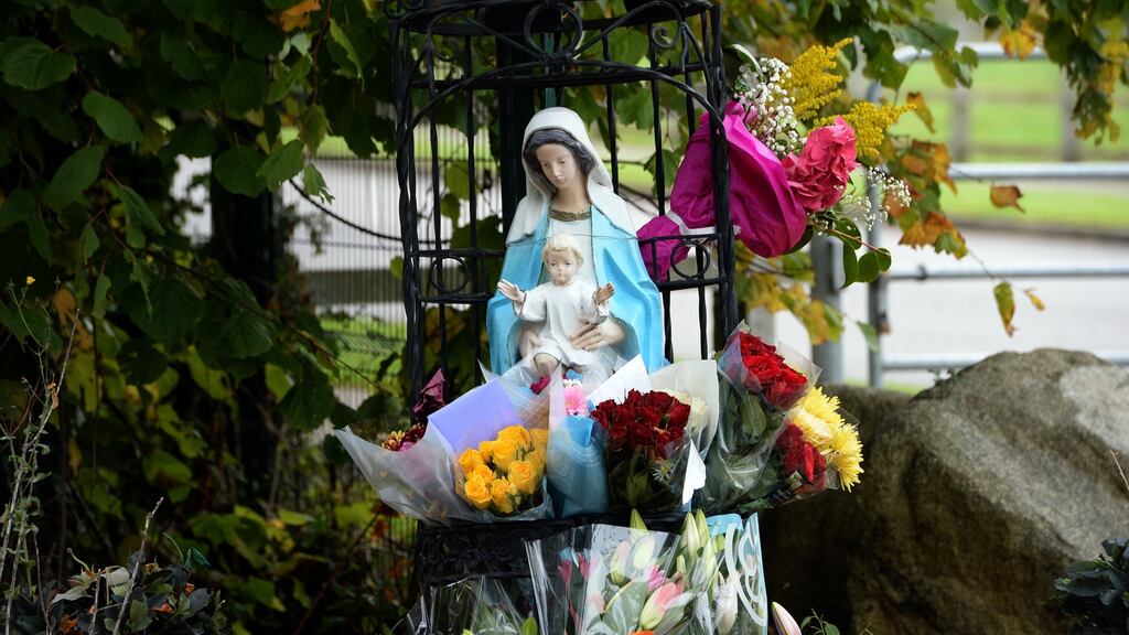 Flowers left in sympithy at the scene of the Carrickmines fire in which 10 people were killed at a halting site on Glenamuck road in south Dublin. Photograph: Eric Luke/The Irish Times.