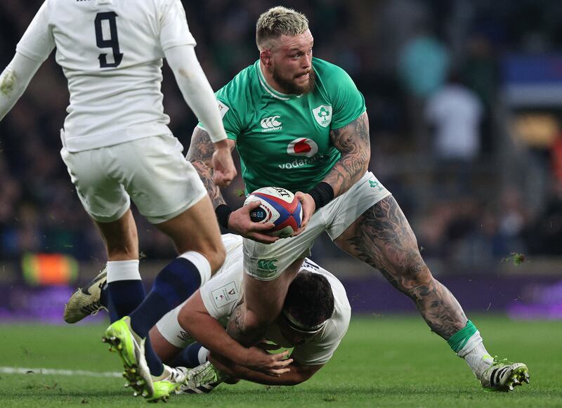 England hooker Jamie George tackles Ireland prop Andrew Porter during the Six Nations game at Twickenham. Photograph: Adrian Dennis/Getty Images