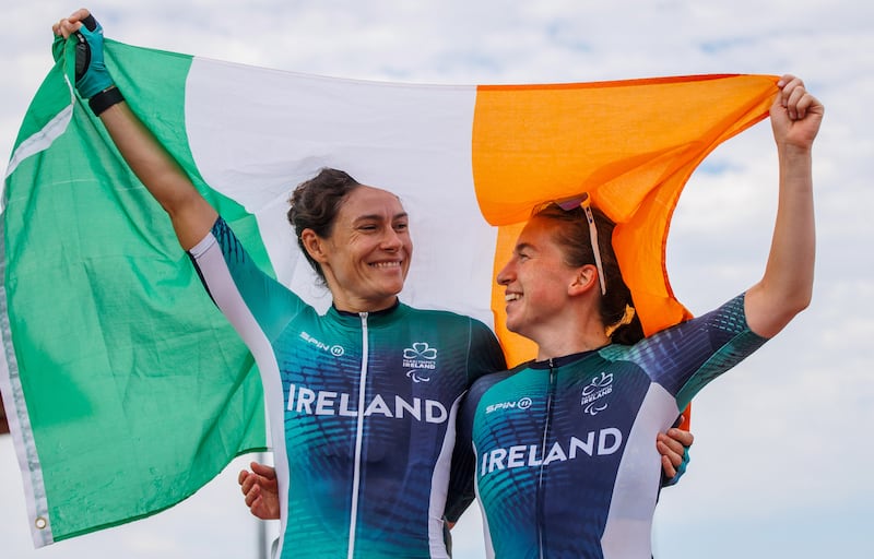 Linda Kelly and Katie-George Dunlevy celebrate winning silver in the women's B road race at the Paralympics in Paris. Photograph: Tom Maher/ Inpho