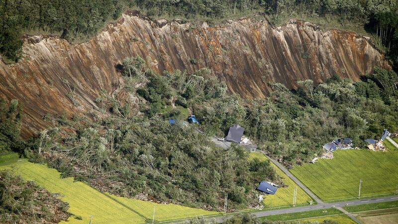 Houses damaged by a landslide caused by an earthquake, are seen in Atsuma town in Japan’s northern island of Hokkaido. Photograph: Kyodo/via Reuters