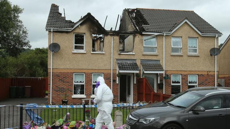 A police forensic officer at the scene of a house fire on Hazel View in Lagmore, Belfast where Jennifer Dornan, 30, was found dead on Sunday, August 2nd. Photograph: Niall Carson/PA Wire