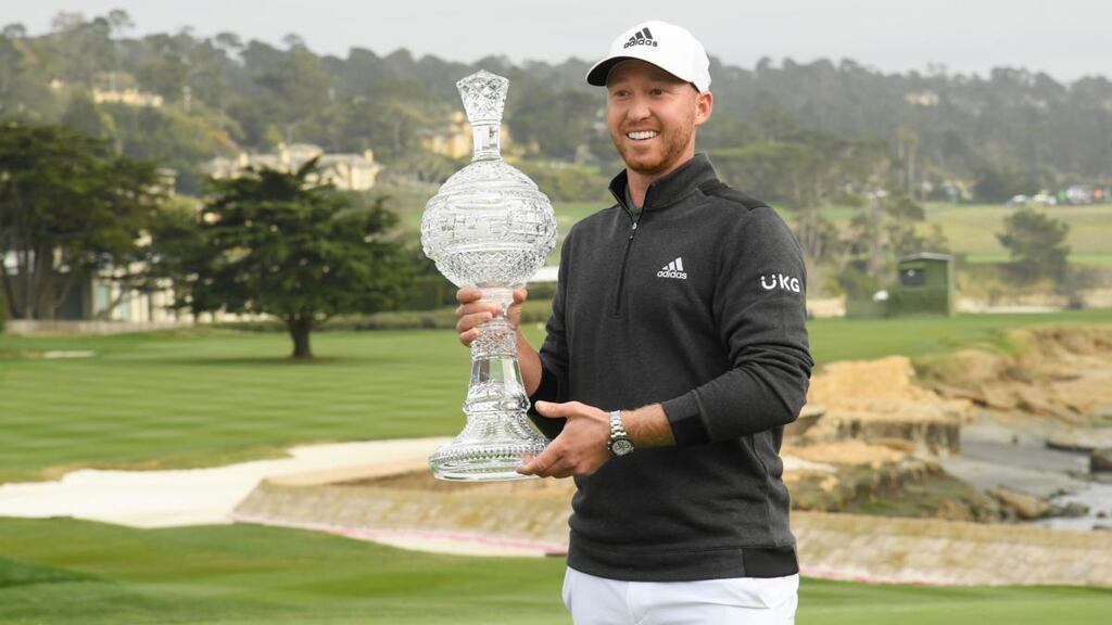 Daniel Berger with the trophy after his win at Pebble Beach. Photograph: Harry How/Getty