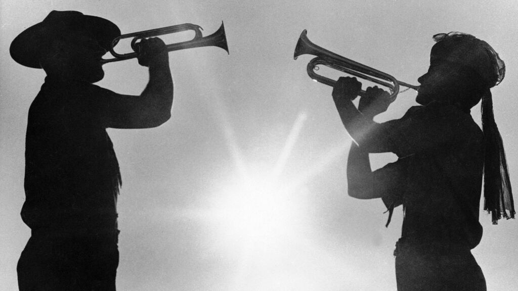Two boy scout members play the bugle at the 12th World Boy Scout Jamboree at Farragut State Park in Idaho in 1967. The Boy Scouts of America has filed for bankruptcy protection as it faces a barrage of new sex-abuse lawsuits. Photograph: Jack Kanthal/AP Photo