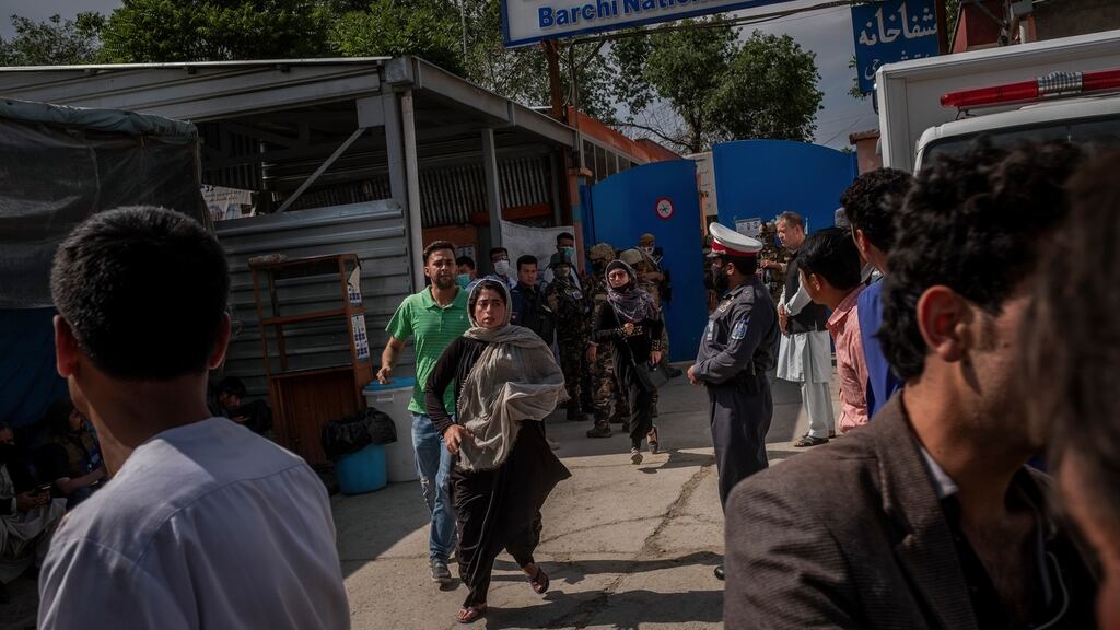 People flee a health care facility in Kabul after an attack the United States blamed on the Islamic State group on May 12th, 2020. Photograph: Jim Huylebroek/The New York Times