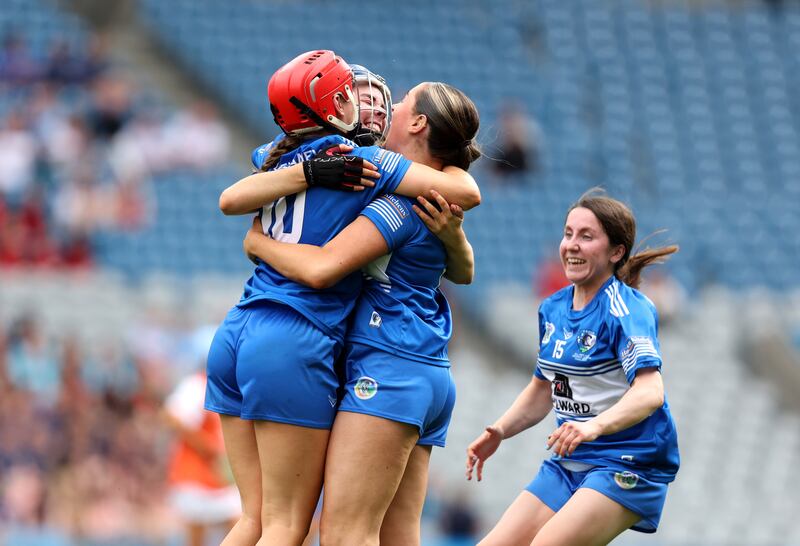 Laois' Grainne Delaney, Aimee Collier and Kirsten Keenan celebrate after the final whistle. Photograph: Bryan Keane/Inpho