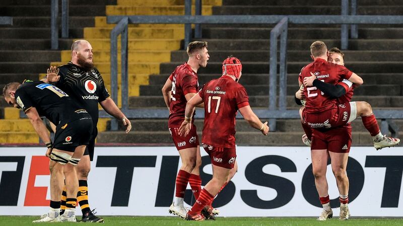 Munster celebrate after Rory Scannell rounds off the scoring against Wasps. Photograph: Billy Stickland/Inpho
