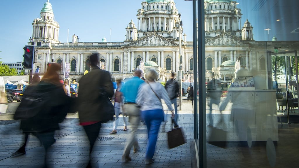 Shoppers in front of Belfast city hall. Photograph: iStock