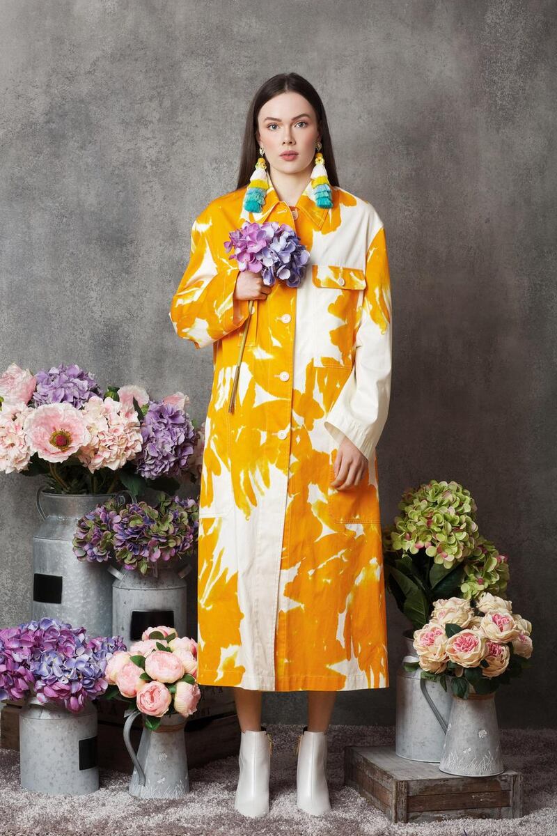 Yellow and white coat €1,125 Dries Van Noten, Brown Thomas, boots €80 River Island, earrings €32 Om Diva.